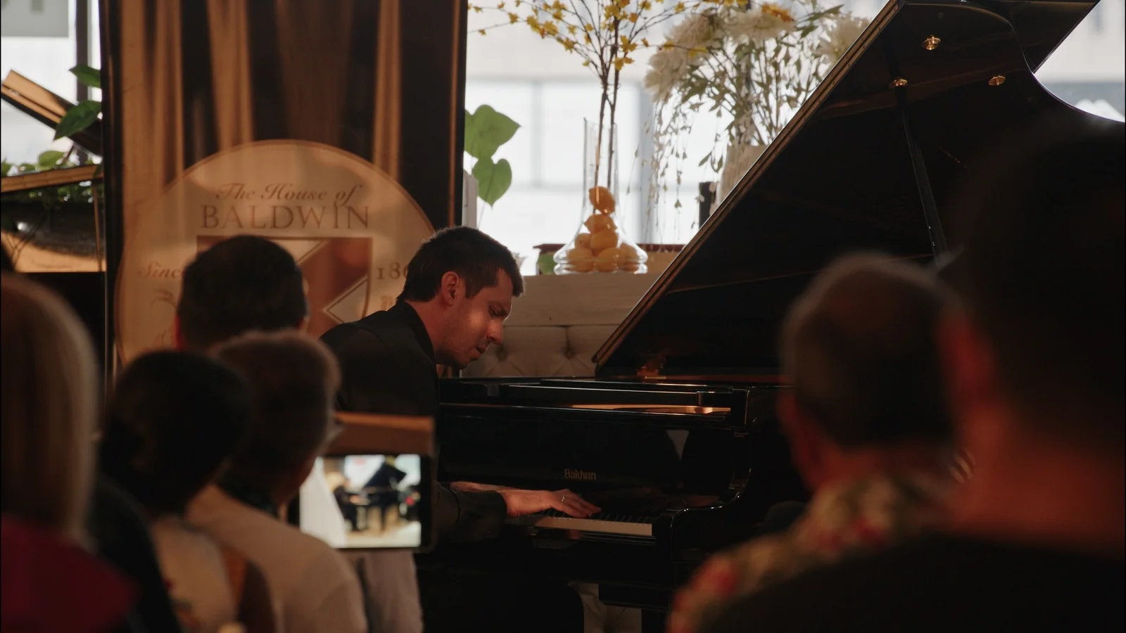 A piano performance in the gallery